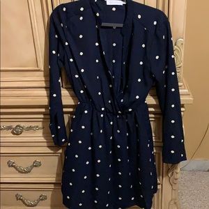 Navy blue, polka dot dress with long sleeve.